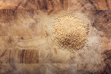 Seasame seeds on a wooden rustic table