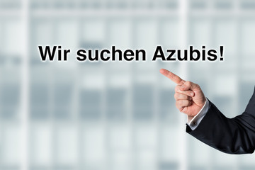 Business man pointing at the words We are looking for employees