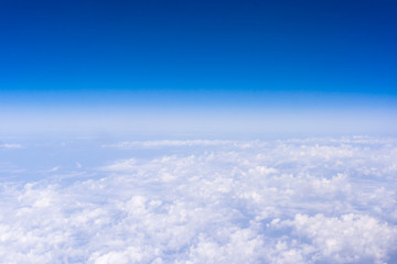 Fototapeta na wymiar Skyline View above the Clouds from air plane. Sky background