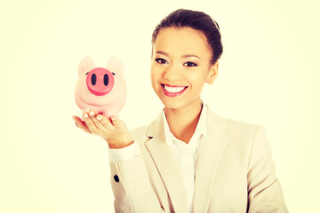 Business woman with a piggybank.