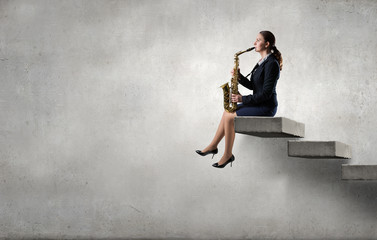 Woman saxophonist. Concept image