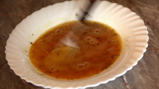 Cook making hen egg mixture prior deep frying; close up; hd 1080 footage
