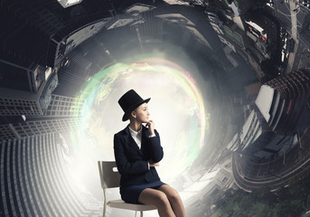 Girl in black cylinder