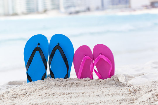 Color slippers on beach