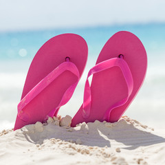 Color slippers on beach