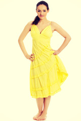 Beautiful female model in yellow dress.