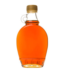 Maple syrup in a glass bottle over white background