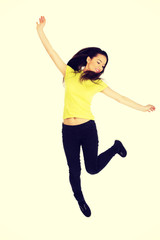 Young casual woman jumping. 