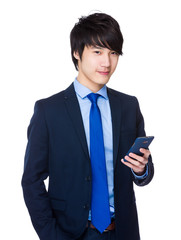 Asian Young Businessman use of the mobile phone
