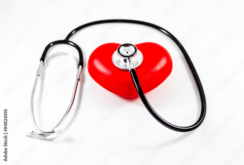 Wall mural medical stethoscope and heart on white background