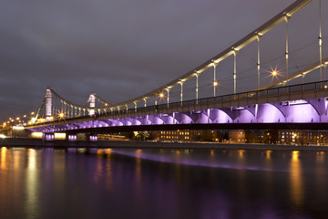 Krymsky Bridge or Crimean Bridge at night is a steel suspension bridge in Moscow, Russia.