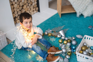 Portrait of A Cute boy with a christmas lights