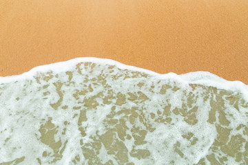 Calm sea waves breaking on sandy beach as background resources