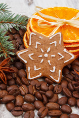 Decorated gingerbread, coffee grains and spices, christmas time