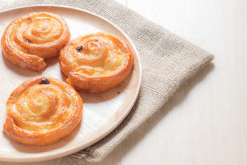 Cinnamon and raisin roll bun,still life style from above.