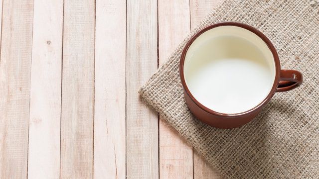 Milk in vintage cup,from above.