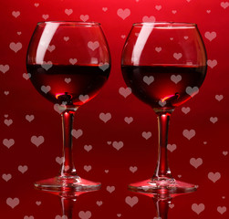 Wineglasses on red background