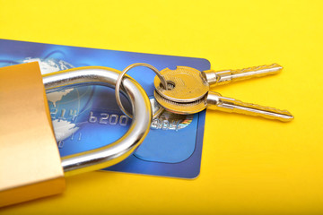Padlock on Credit card Isolated  Yellow Background