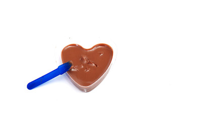 Sweet  liquid chocolate in a heart shaped can