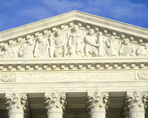 Fototapeta na wymiar Carved figures in pediment of the United States Supreme Court Building, Washington D.C.
