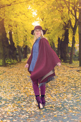 blond woman in a park in autumn