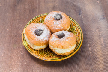 three donuts on a plate