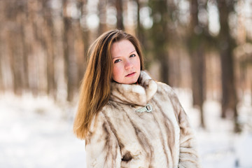 young woman in a winter park 