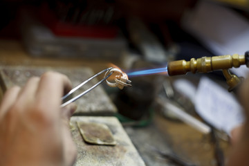 Fototapeta na wymiar ewelry making close-up details of the production