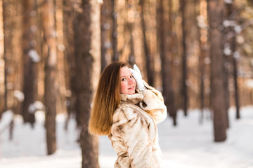 young woman in a winter park 