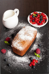 Delicious cake, milk and berries