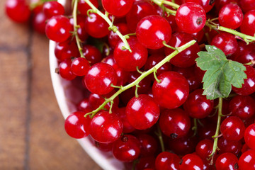 Fresh red currants in bowl close up
