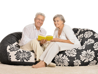 Senior couple reading 