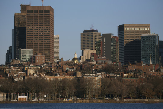 Boston Skyline In Winter On Half Frozen Charles River, Massachusetts, USA, 03.18.2014