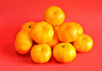 tangerine on red background