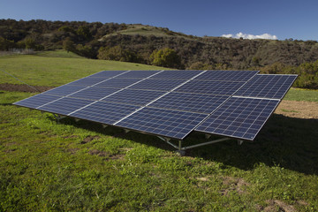 Solar panels and green grass, Oak View, California, USA, 04.05.2014
