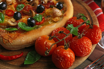 Heart shaped pizza on wooden table closeup