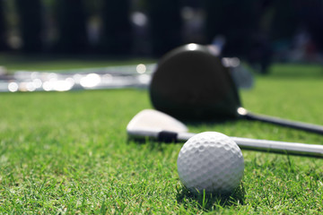 Golf clubs and ball on a luxury golf course, close up