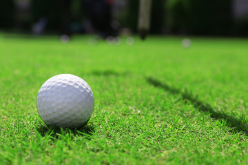 Golf ball on green golf course