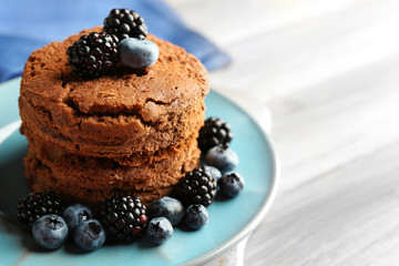 Cake with berries on wooden table