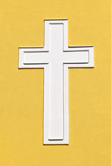 White cross on the church wall