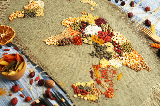 Spices on sackcloth on wooden background