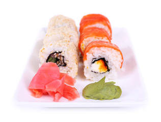 Tasty rolls, ginger and wasabi isolated on white