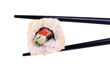 Chopsticks holding one piece of roll isolated on white