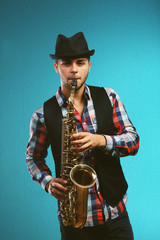 Saxophone player on blue background