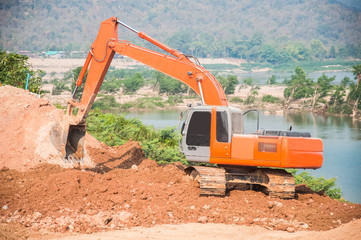 excavator loader machine during earthmoving works outdoors at co