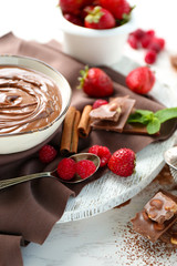 Beautiful composition with chocolate cream and raspberries