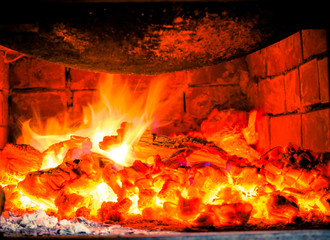 Firewood beautifully lit in the fireplace
