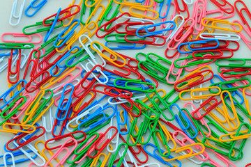 Colorful paper clips set on white background.
