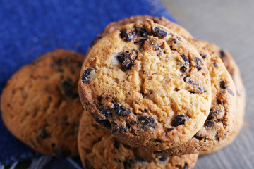 Cookies with chocolate crumbs on wooden table, close up