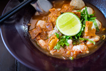 Thai Noodles spicy tom yum soup with pork